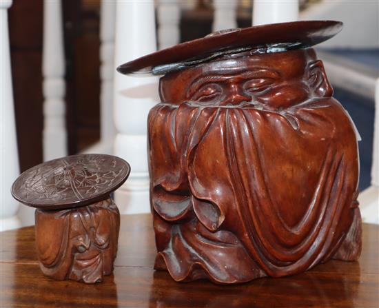 Two carved figural hardwood jars